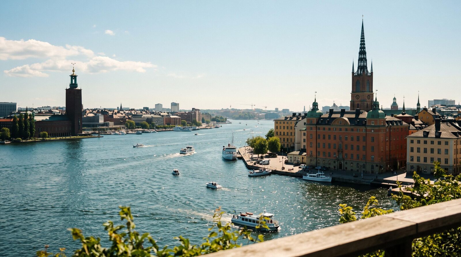 Stockholm waterfront in summer sun, with the City Hall tower and the Riddarholmen spire